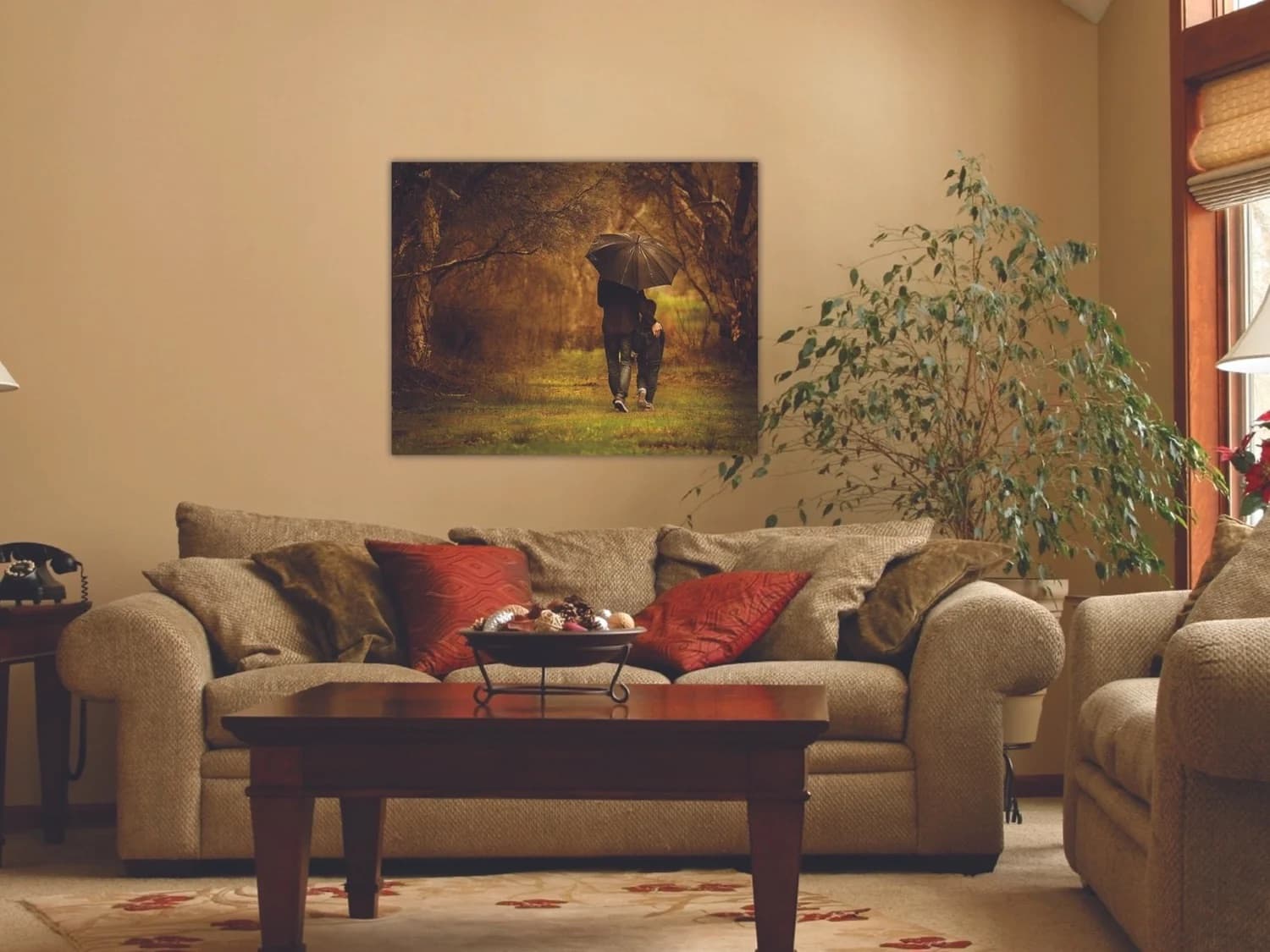 A canvas portrait hung above a living room sofa