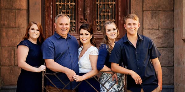 A family of five in front of the Egyptian Doors