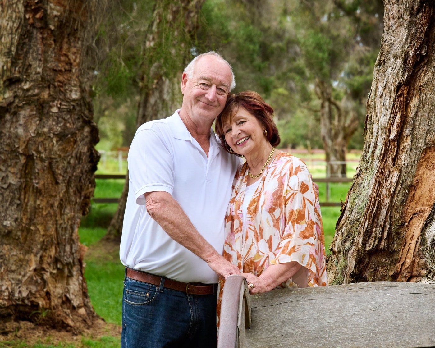 Grandparents together under the paperbarks