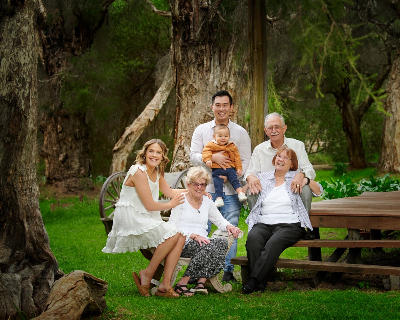 Grandparents with their family at the picnic table
