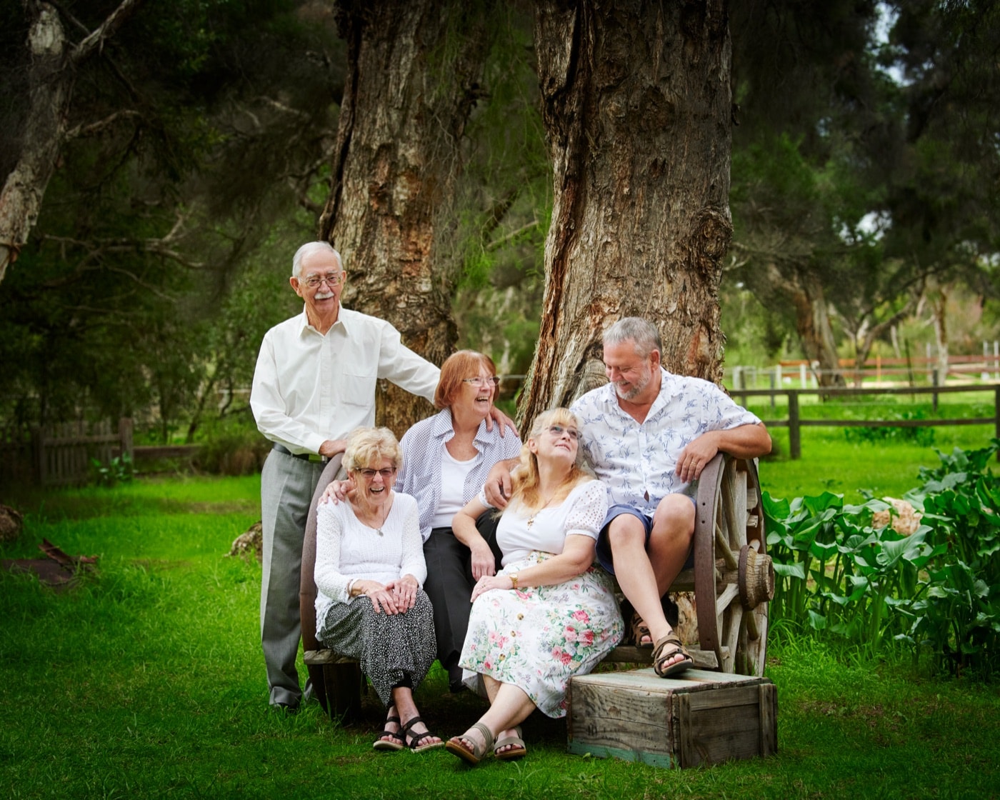 Grandparents and their grown children on the old bench
