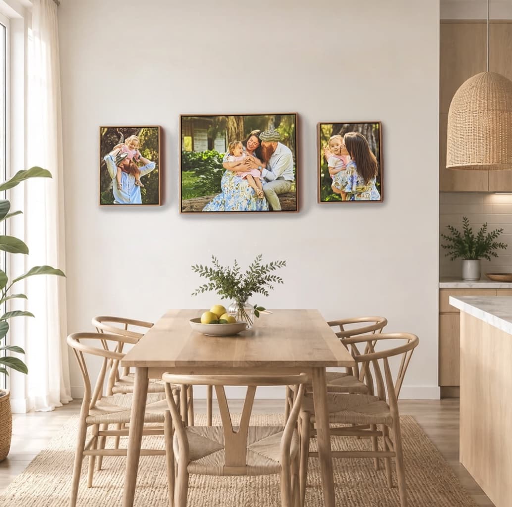 A Gallery Wall Set of three family canvases above a dining table
